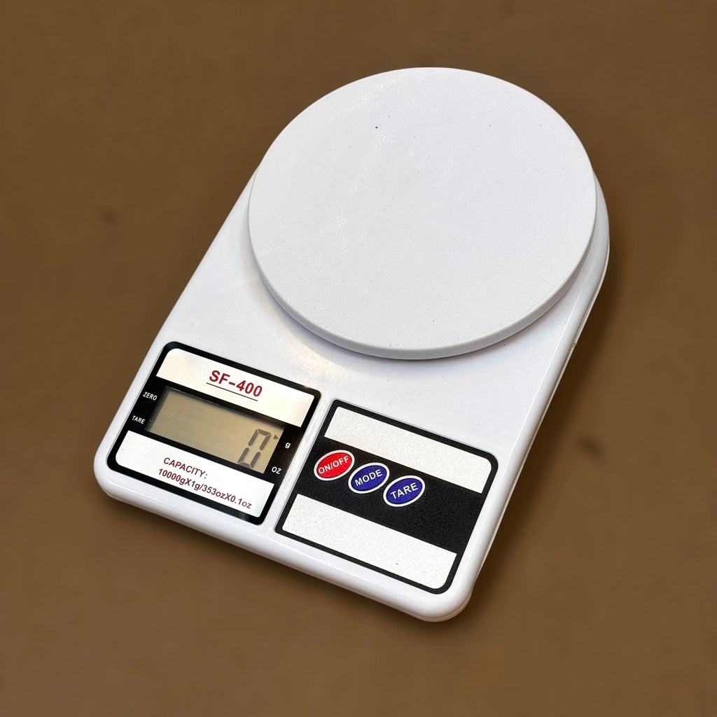 Compact digital scale weighing ingredients