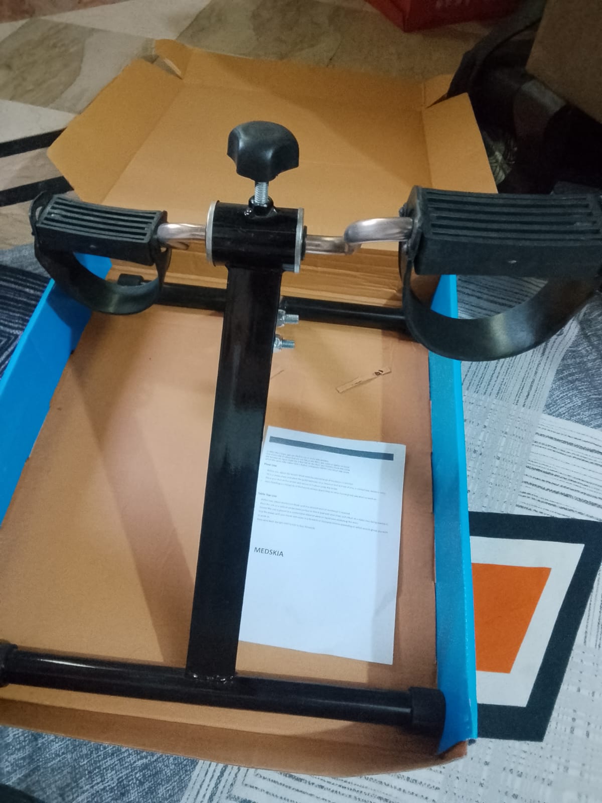 Folding pedal exerciser with non-slip floor grips